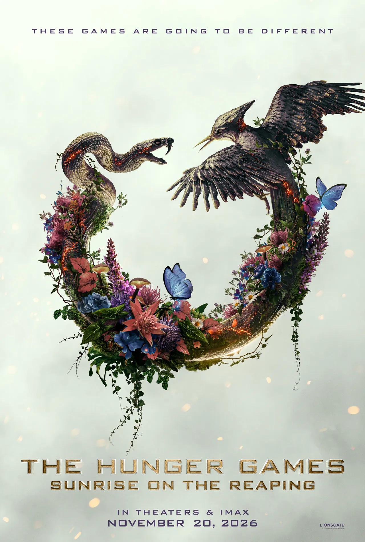 Sunrise on the Reaping teaser poster — a mockingjay and snake circling a wreath of flowers